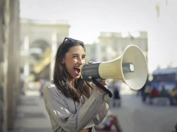Woman telling stories on megaphone