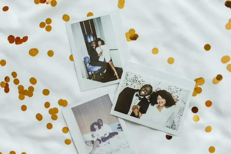 photos of a couple's past memories on a table
