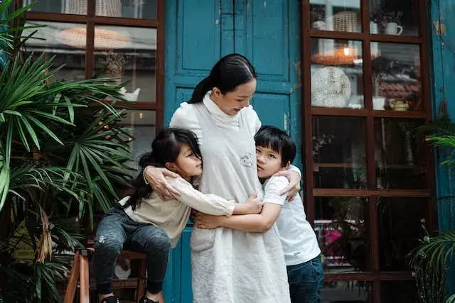mother and children embracing